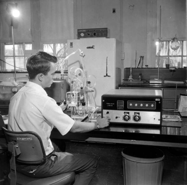 Unidentified man working with scientific equipment at Bayboro Harbor, St. Petersburg, circa 1900